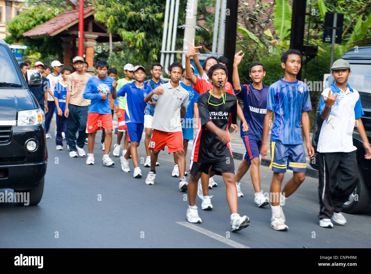 adolescent marchers in kuta, bali, indonesia Stock Photo