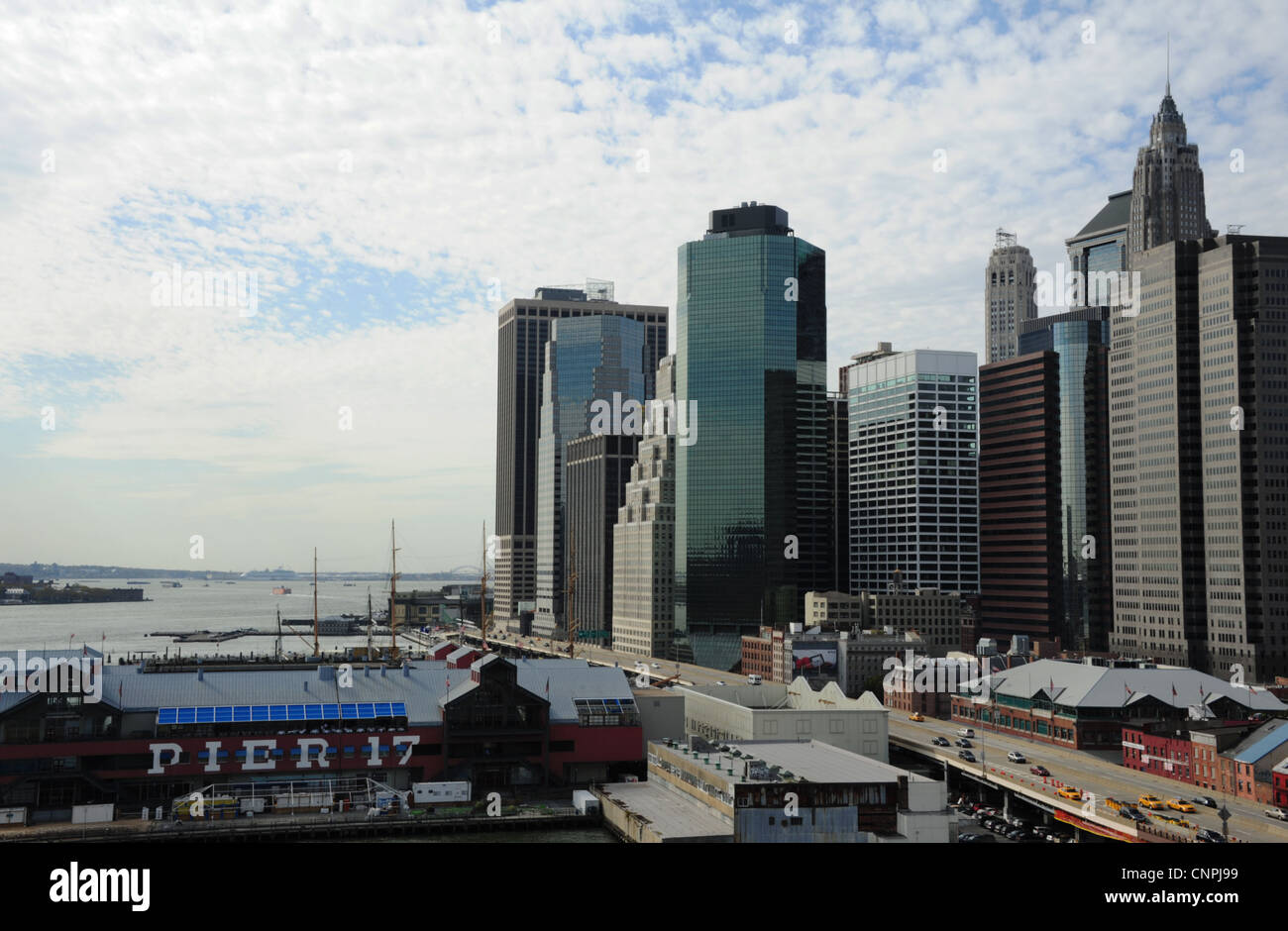 Autumn view, from Brooklyn Bridge, Pier 17, FDR Drive, Lower Manhattan Financial District skyscrapers, New York Stock Photo