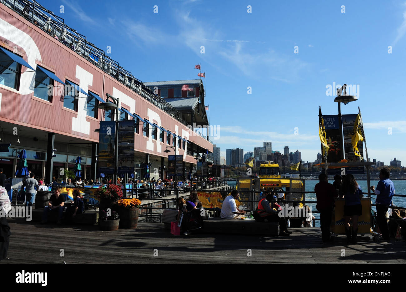 4 american flags flying pier 17 roof hires stock photography and