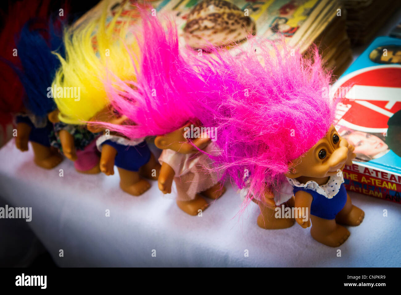 Colorful Troll dolls on sale in an antique market at Warrington. Trolls of this type were a popular fad during the 1960s Stock Photo