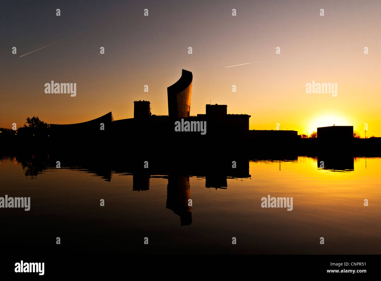 The Imperial War Museum reflected in the Manchester Ship Canal, Salford ...