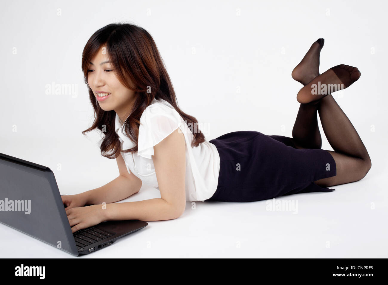 Office lady uses notebook computer Stock Photo - Alamy