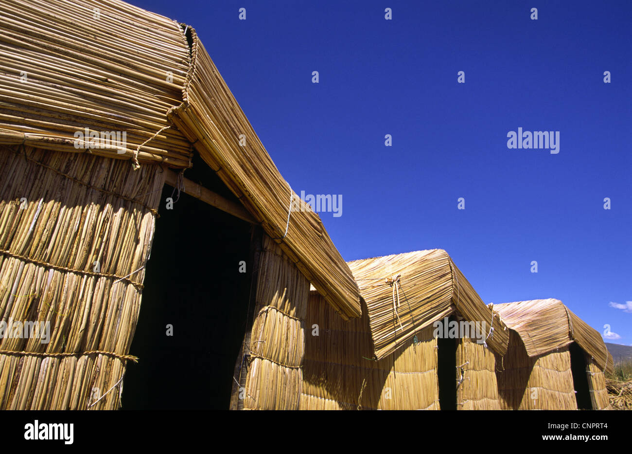 Reed houses on Uros floating islands. Lake Titicaca, Peru Stock Photo