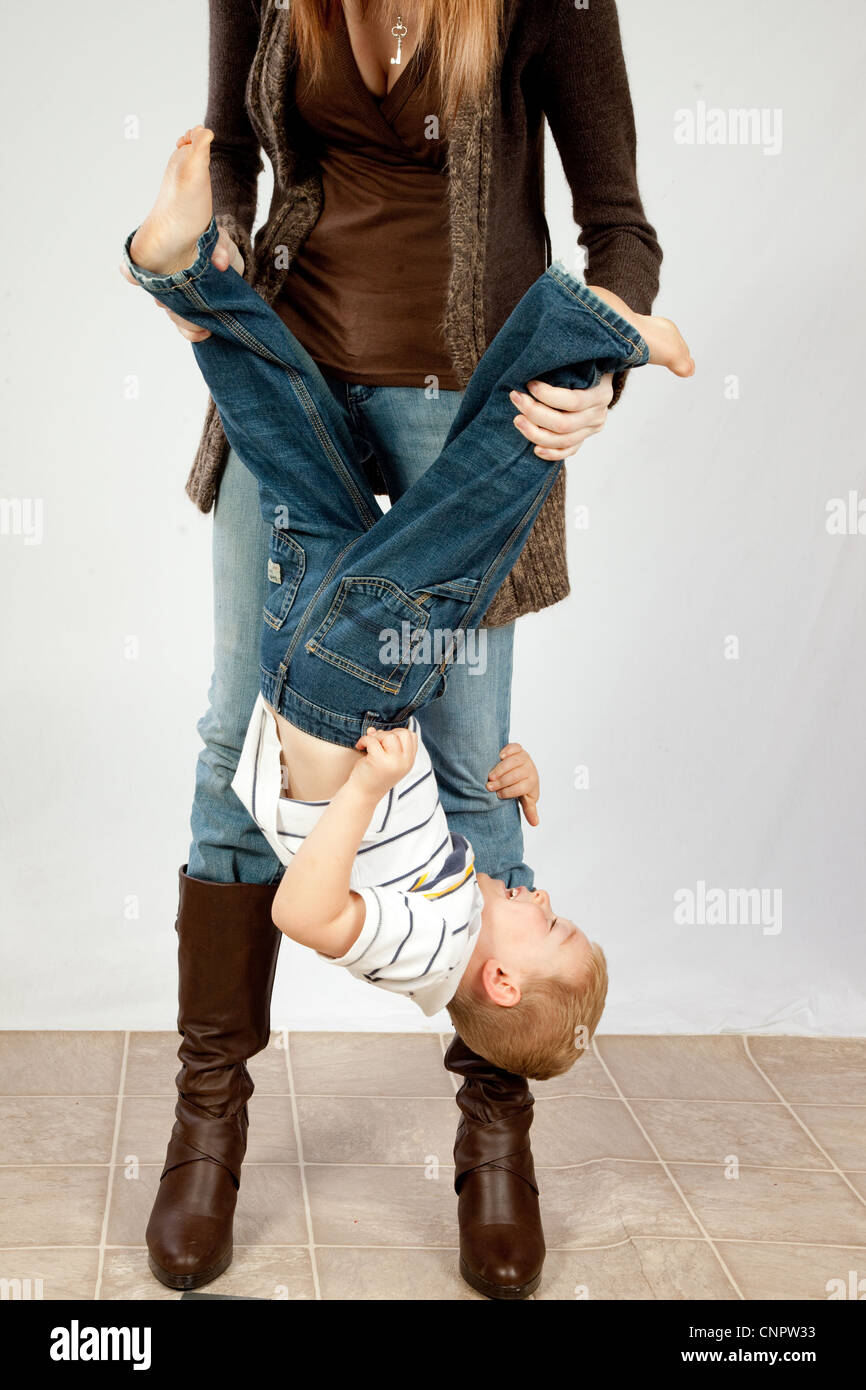 Boy being held upside down hires stock photography and images Alamy