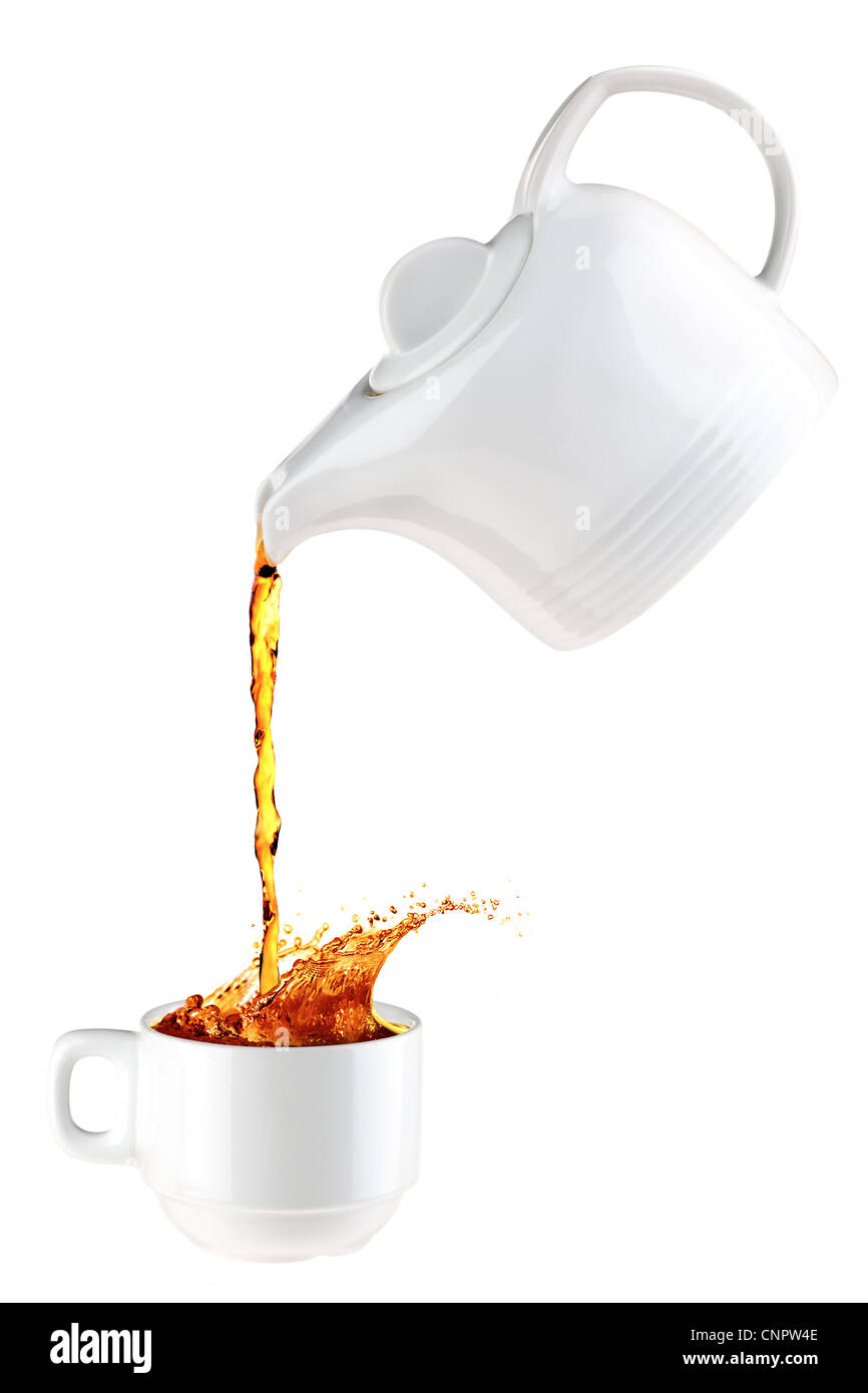 Teapot pouring tea in a white mug Stock Photo Alamy