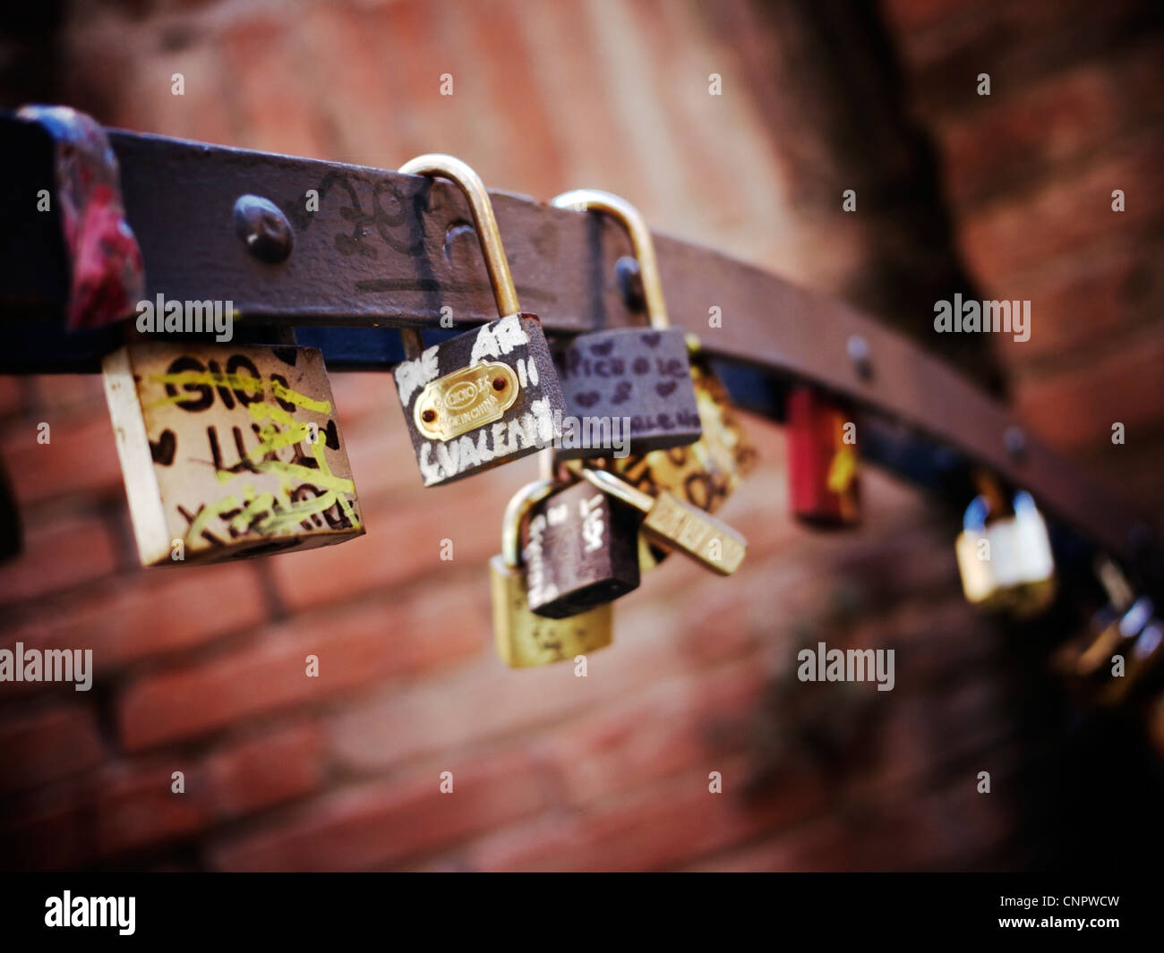 Padlocks locked to a bridge Stock Photo - Alamy