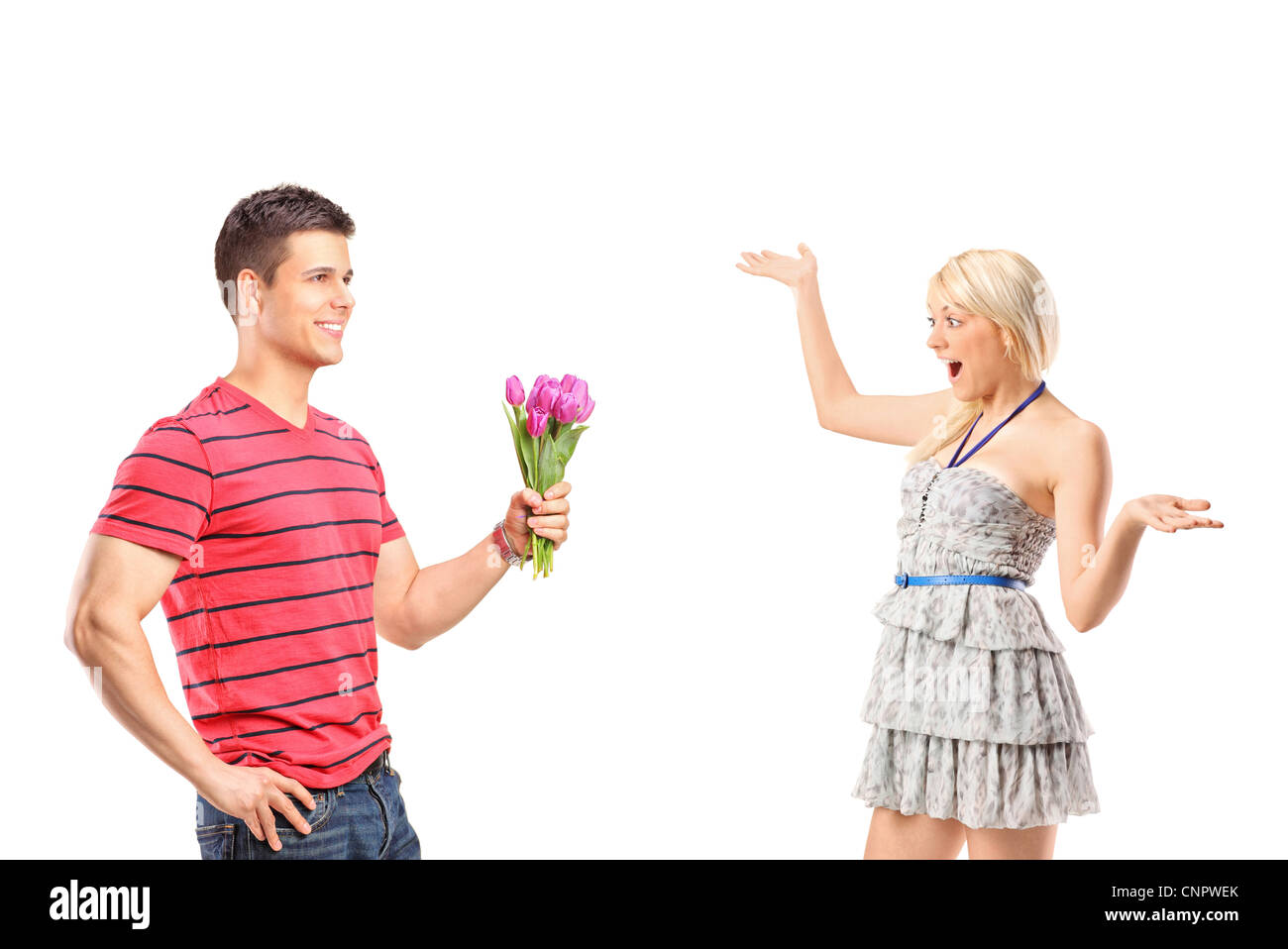 A boyfriend giving a bunch of flowers to his excited woman isolated