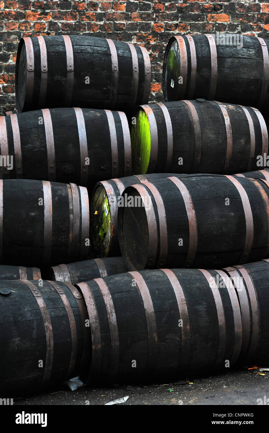 Stacks of old wooden barrels Stock Photo