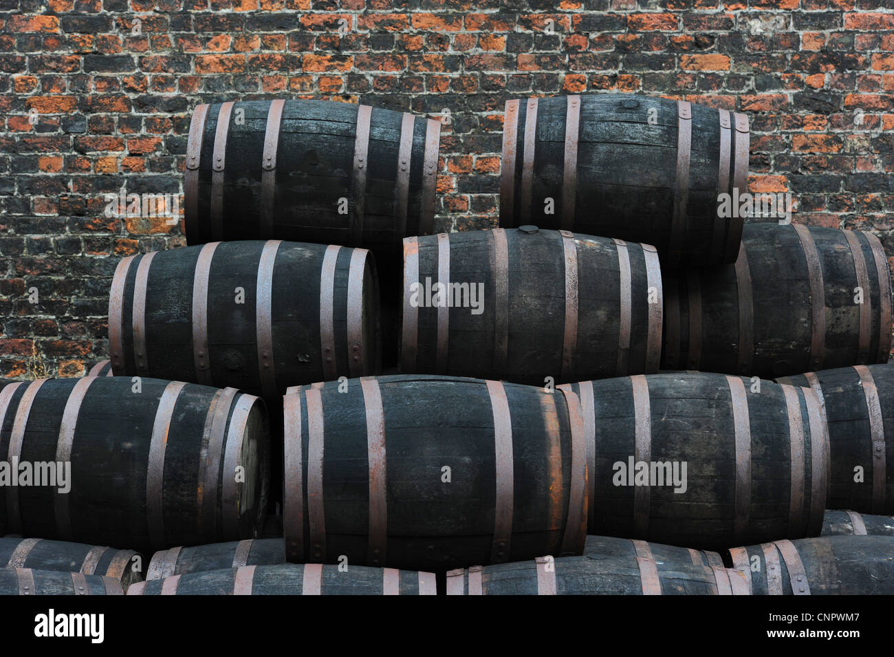 Stacks of old wooden barrels Stock Photo