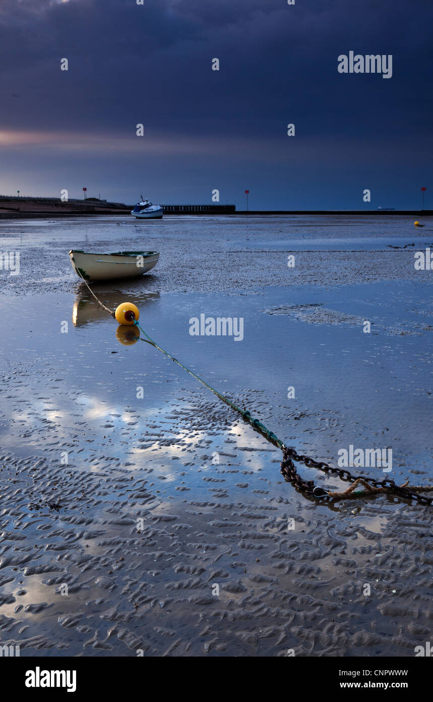 Dinghy, Mooring Chain and Buoy at Low Tide on Mudflats at Thorpe Bay in