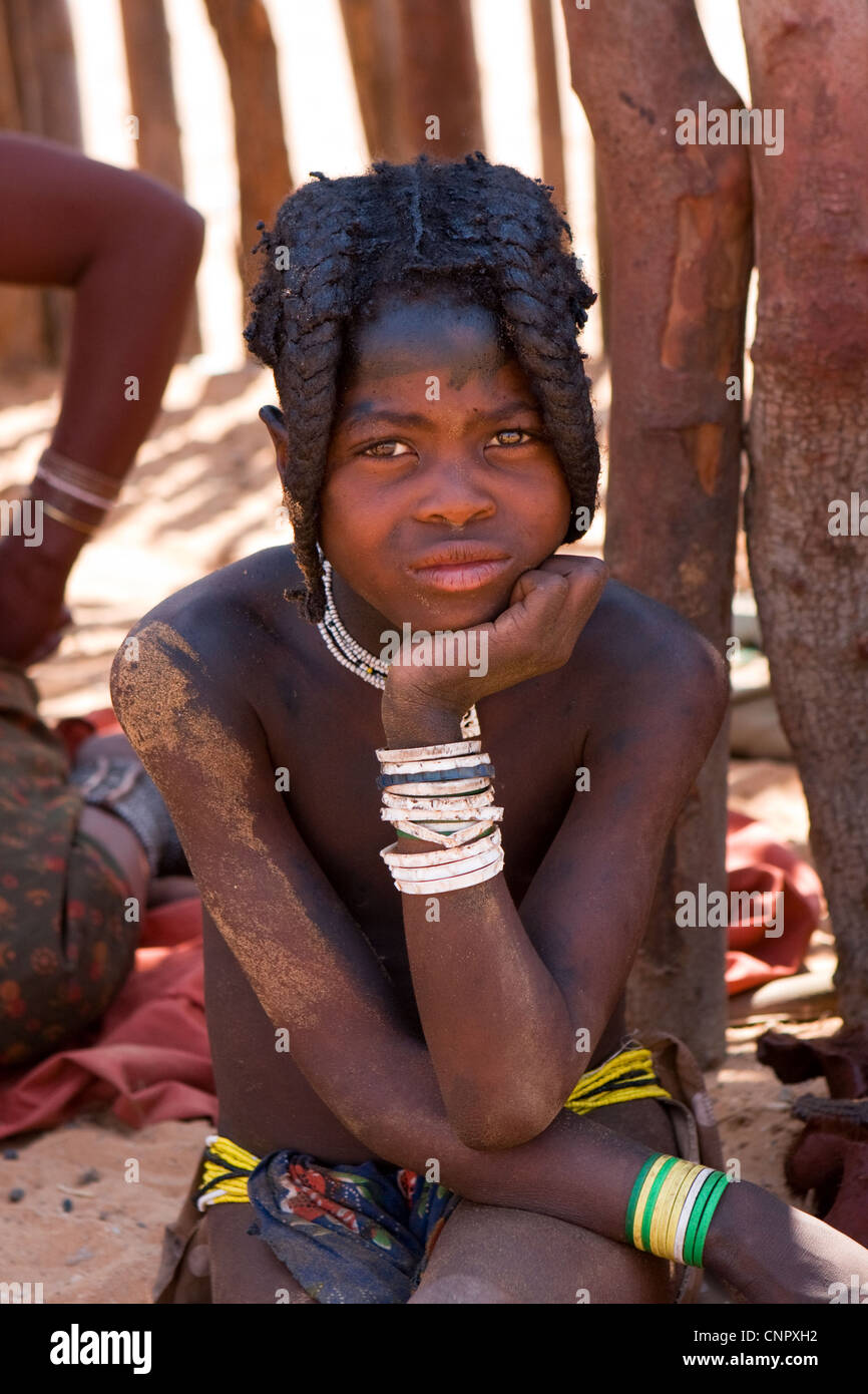 Portrait of a young girl of the traditional Namibian Himba tribe, taken at a tribal homestead in northern Namibia, Africa Stock Photo