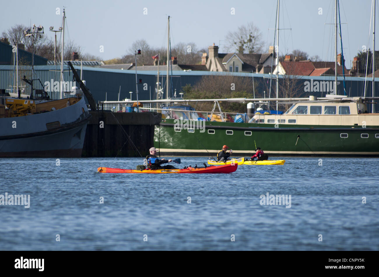 Men fishing from canoes Stock Photo