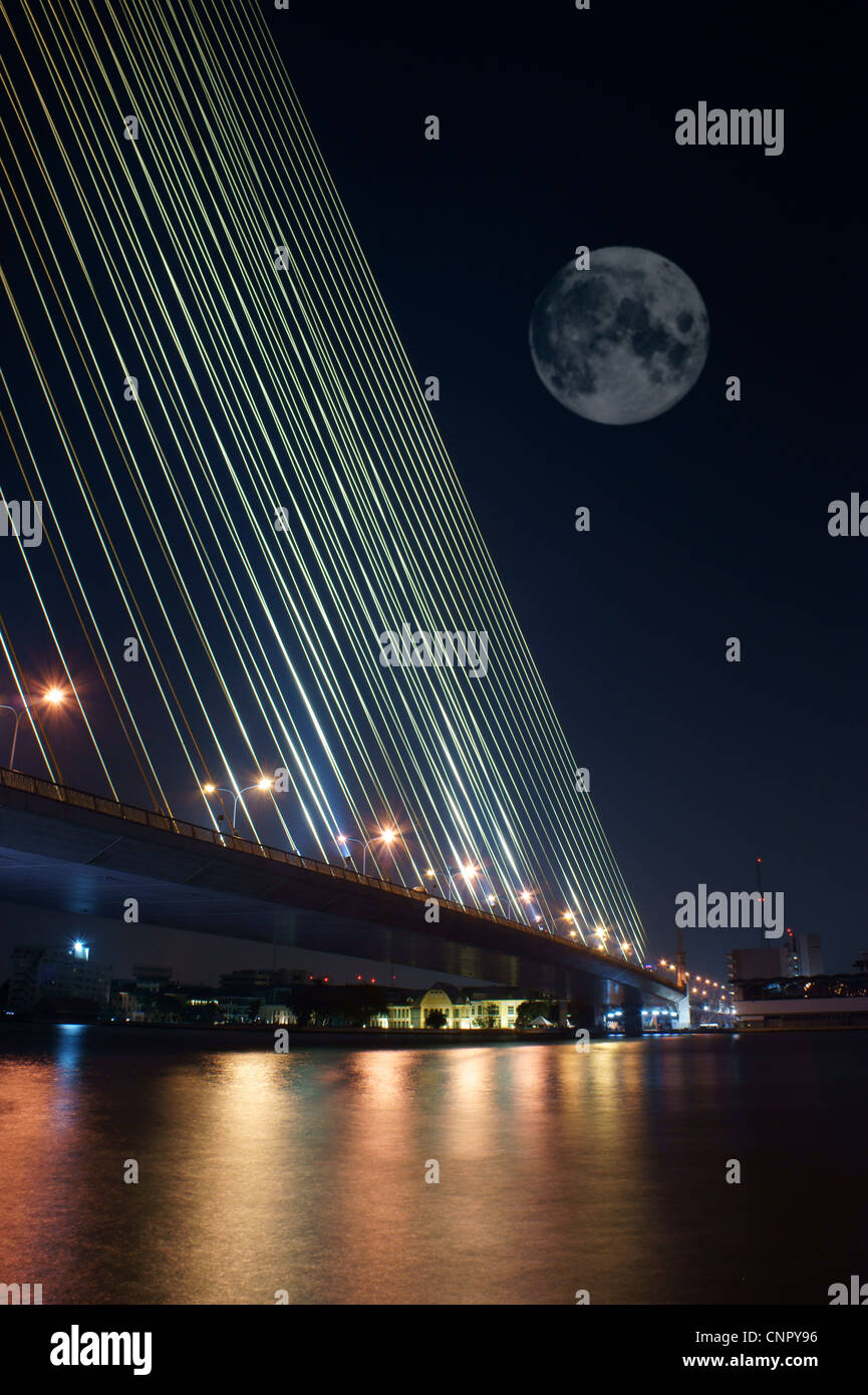 abstract suspension bridge elements on the night city sky with full ...