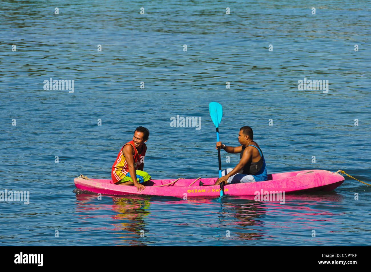 2 Asian men kayaking in ocean kayak Sabang, Puerto Galera, Oriental Mindoro, Philippines
