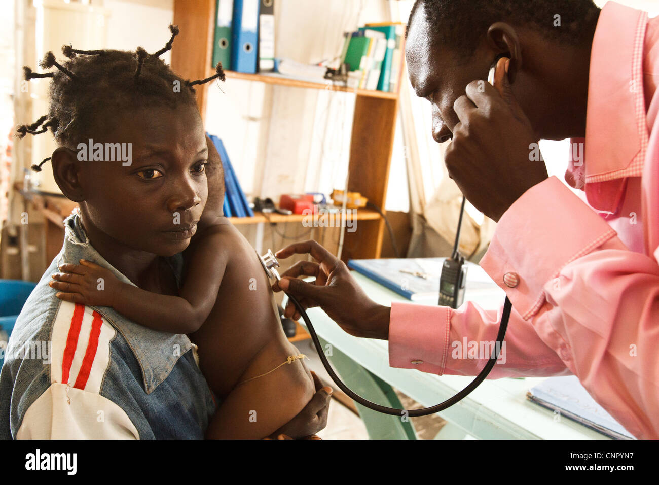 A health worker examines a sick child in a clinic run by MSF next to the Tabacongo health center, in the town of Tabacongo, Kata Stock Photo