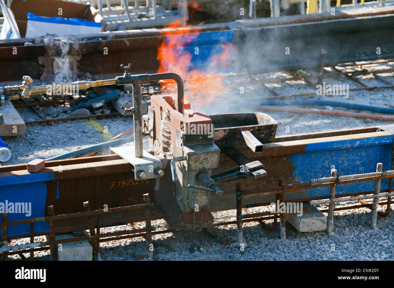 Thermite welding of tram tracks during Metrolink construction, Manchester Rd, Audenshaw, Tameside, Manchester, England, UK Stock Photo