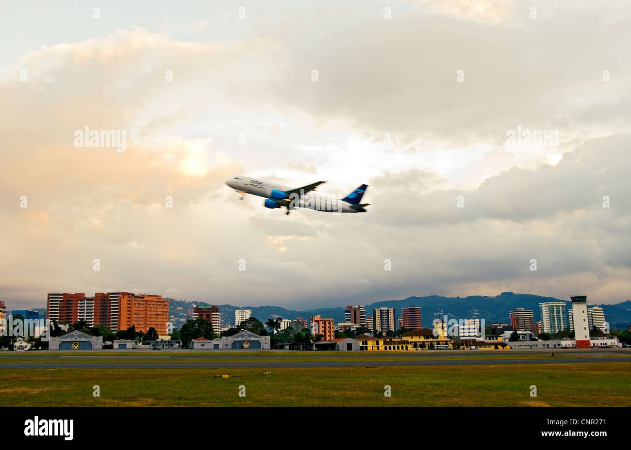 Airplane takes off from La Aurora Airport Stock Photo
