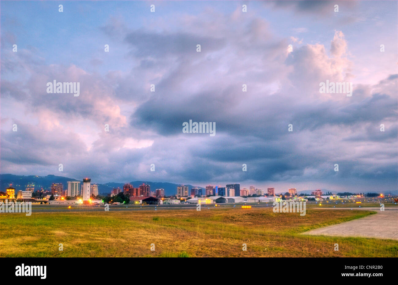 Guatemala City's Zona 14 skyline seen from the tarmac at La Aurora International Airport (GUA). Stock Photo
