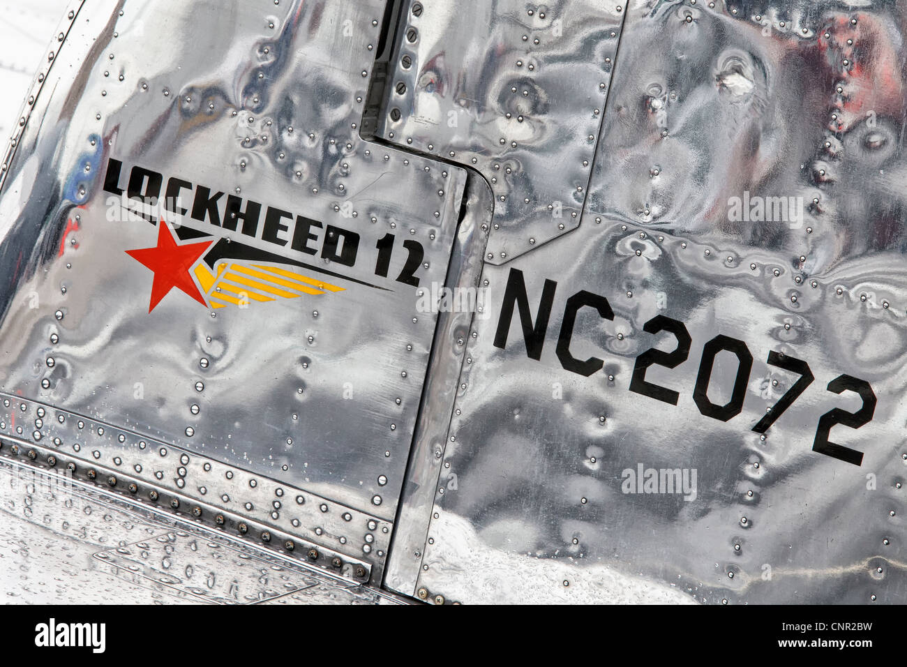 The gorgeous silver metal tail plane of a Lockheed 12 aircraft Stock ...