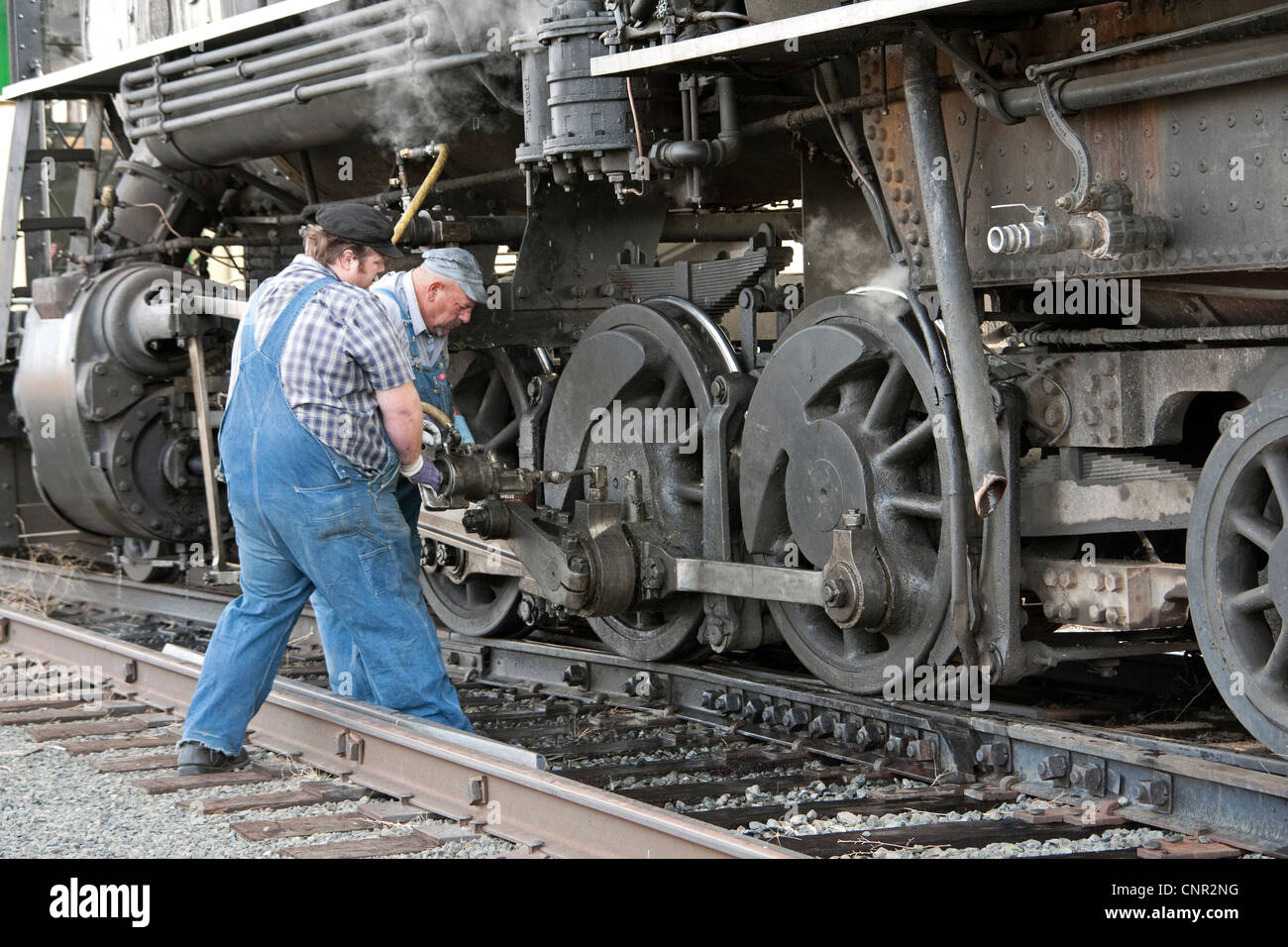 Engineers work on the Virginia and Truckee Railroad tourist train that runs between Carson City and Virginia City, Nevada, USA Stock Photo
