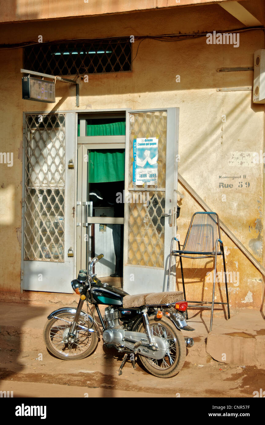 A motorcylce outside of a shop in Djenne, Mali. Stock Photo