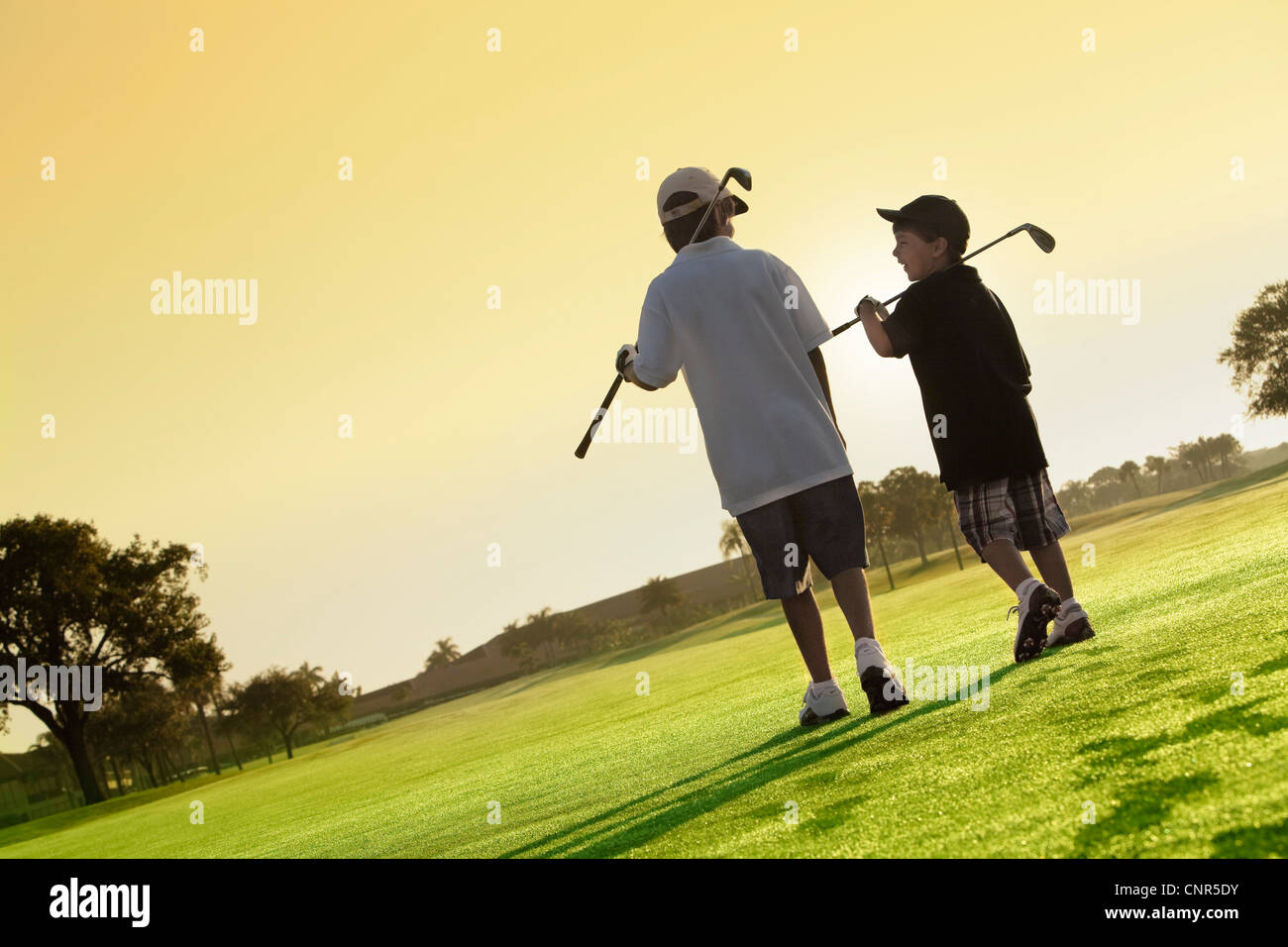Boys on Golf Course, PGA National Resort and Spa, Palm Beach Gardens, Florida, USA Stock Photo