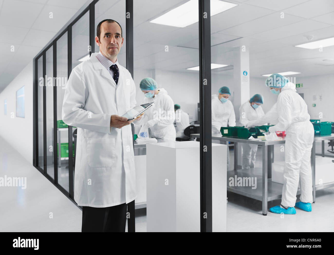 Scientist using tablet computer in lab Stock Photo