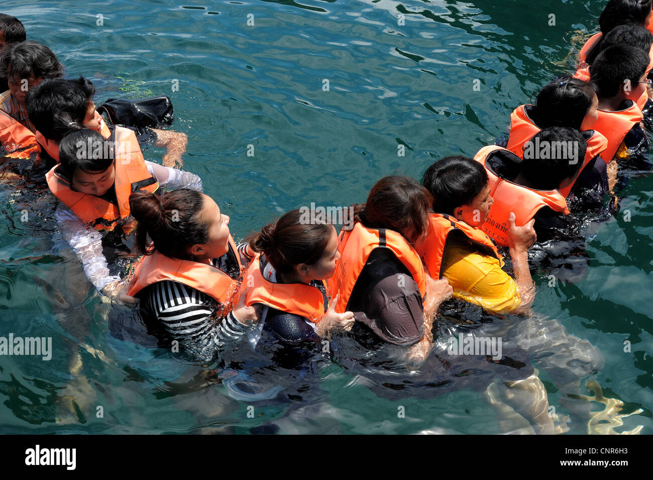 chain of swimmers Swimming into Morakot cave , the island of koh mook ...