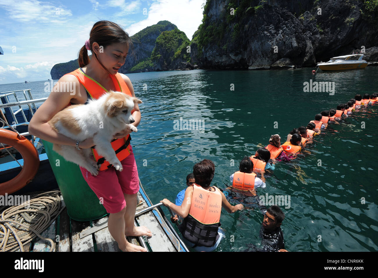 chain of swimmers Swimming into Morakot cave , the island of koh mook ...
