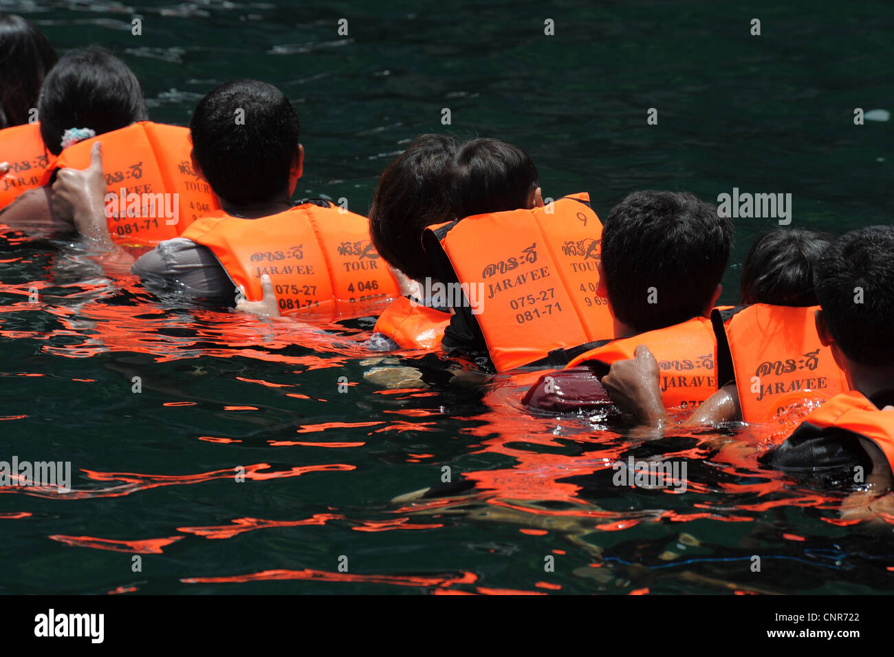 chain of swimmers Swimming into Morakot cave , the island of koh mook ...