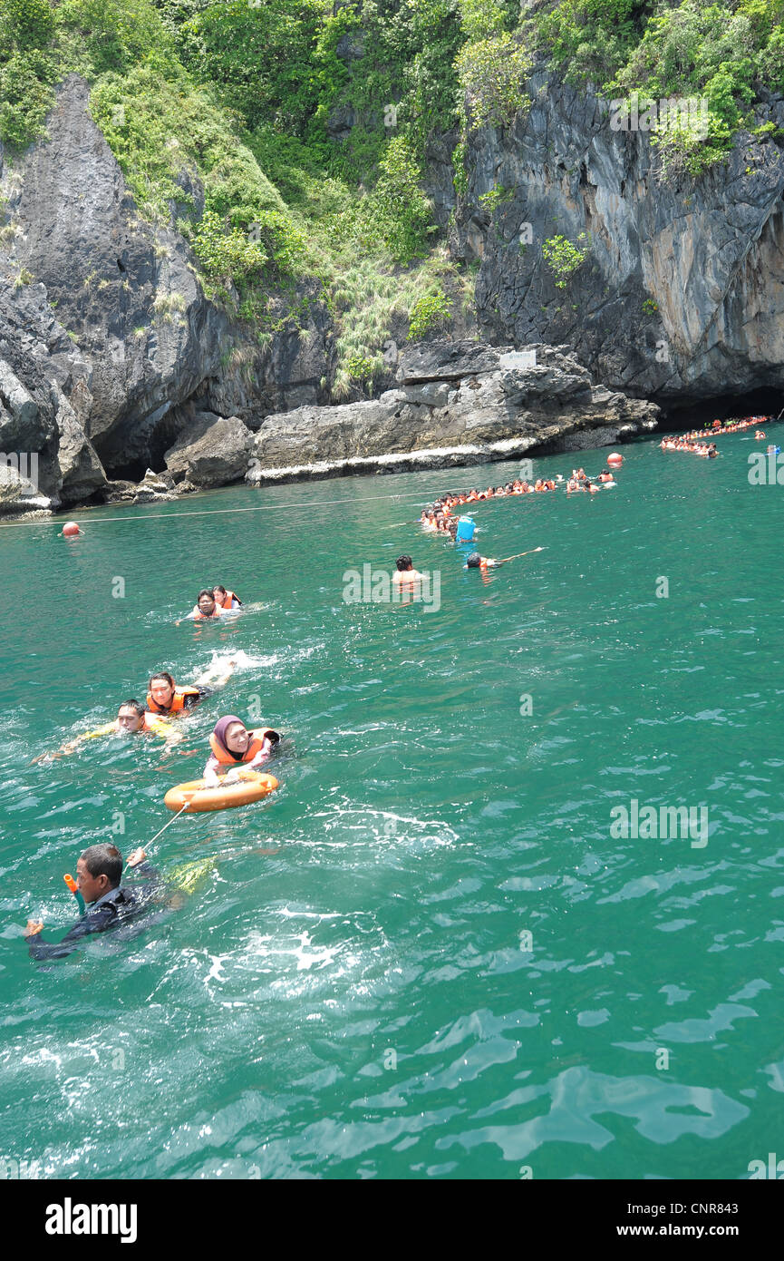 swimmers returning from morakot cave(emerald cave),the island of koh mook (also known as ko muk) , andaman sea, trang ,thailand Stock Photo