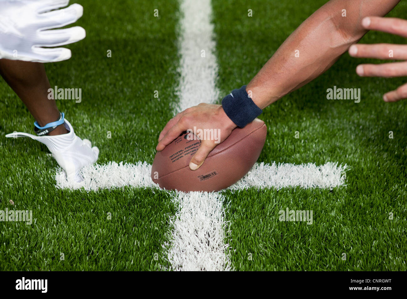 Football players at line of scrimmage, cropped Stock Photo Alamy