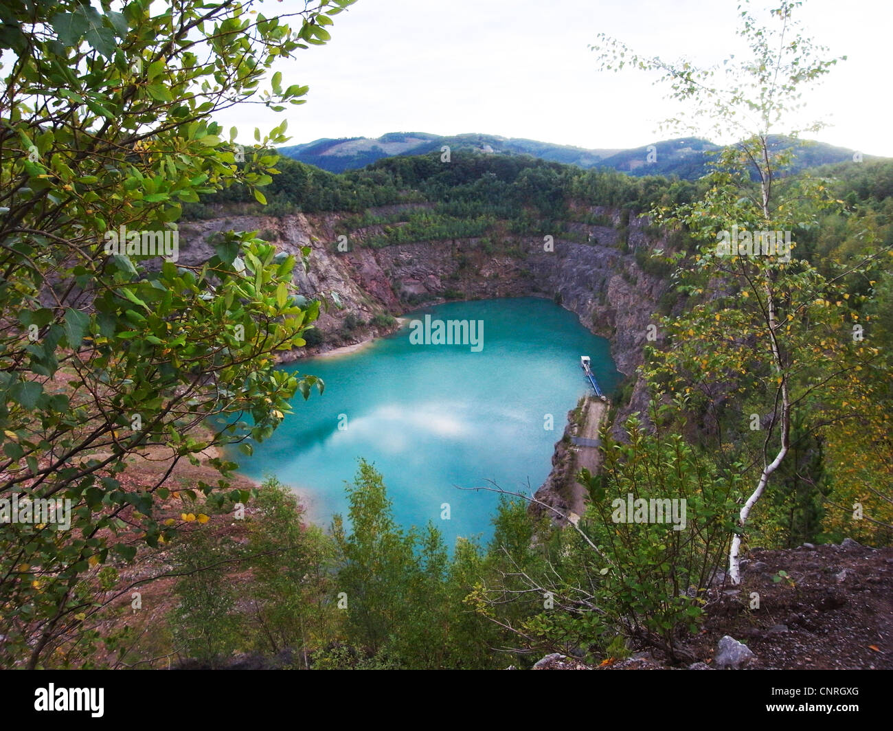 lime stone querry with lake, Germany, North Rhine-Westphalia, Ruhr Area, Hagen Stock Photo