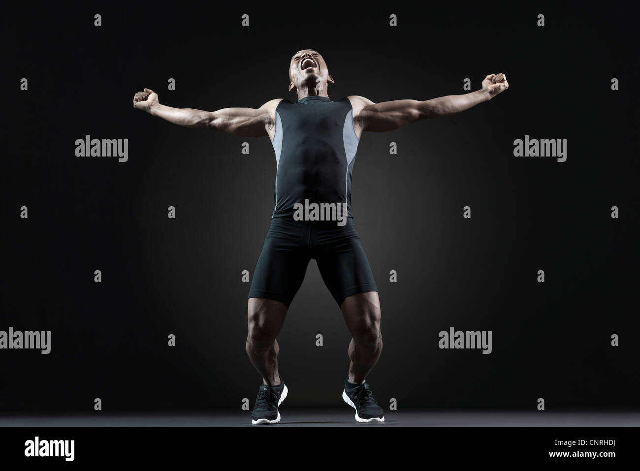 Male athlete shouting with excitement Stock Photo