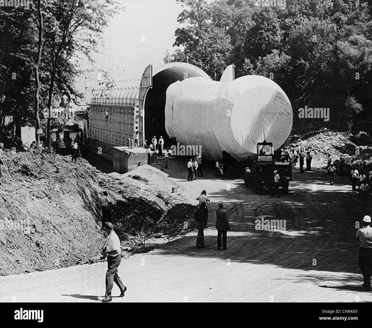 Saturn rocket component being loaded on the barge Palaemon at Wheeler Dam. Stock Photo