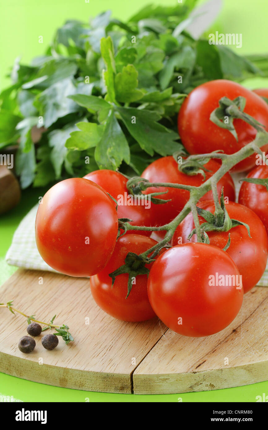 Fresh cherry tomatoes on a wooden board Stock Photo - Alamy