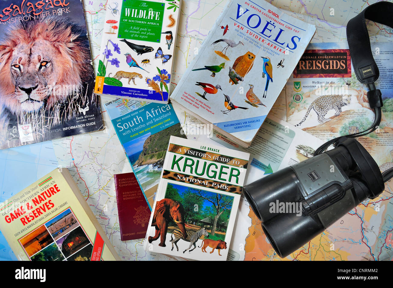 Binoculars, travel guides, guidebooks, African wildlife determination books and South African