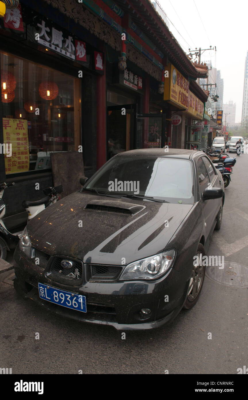 Black Subaru Imprezza parked on a side street in Beijing Stock Photo