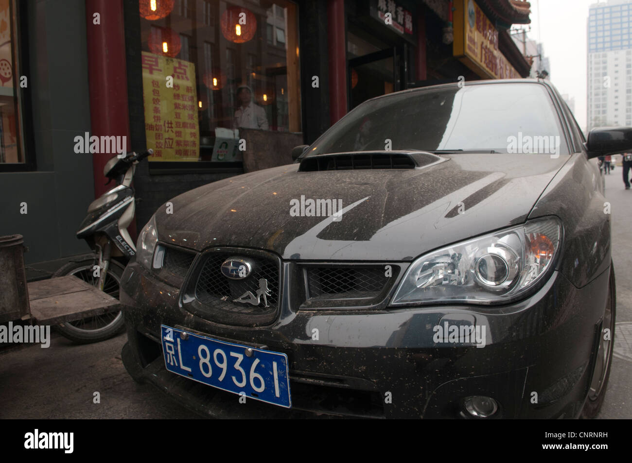 Black Subaru Imprezza parked on a side street in Beijing Stock Photo