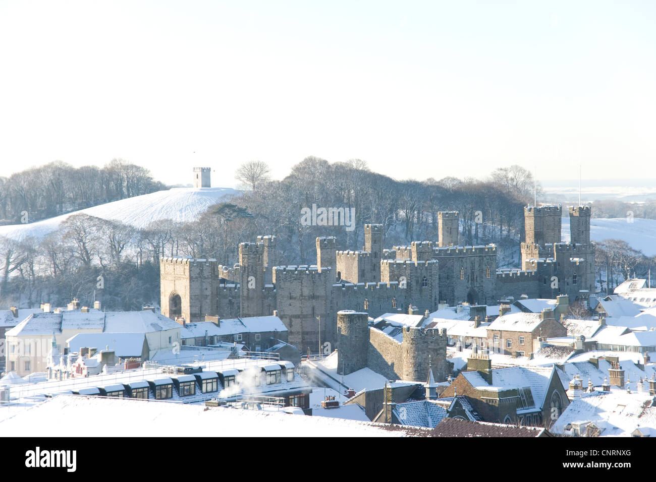 Caernarfon castle and town from Twthill in the snow, Gwynedd,North