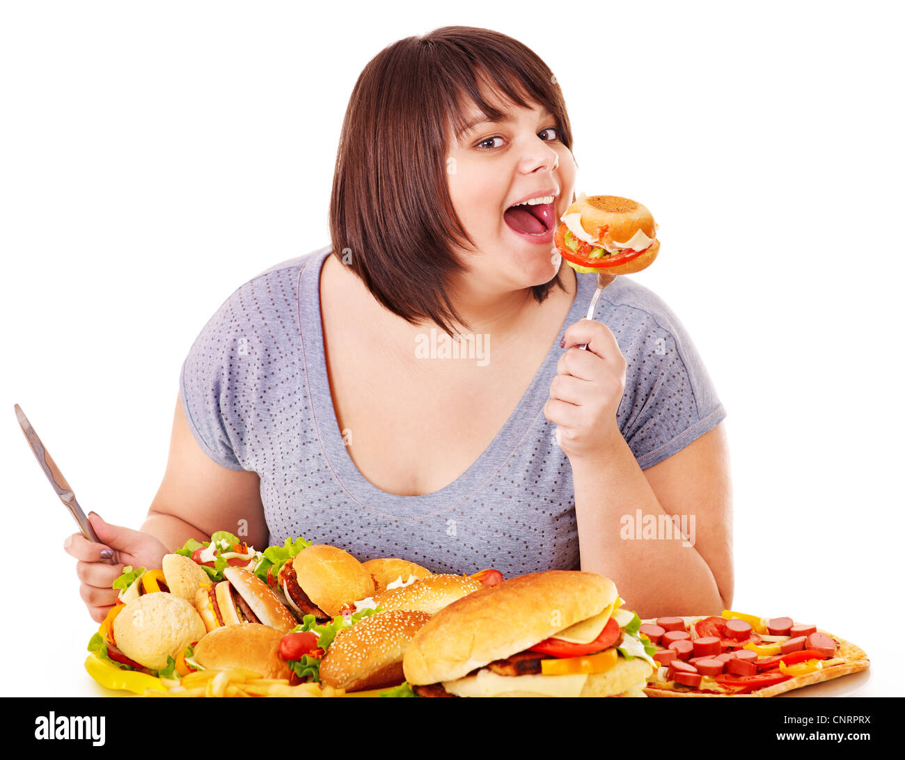 Woman eating fast food. Isolated Stock Photo Alamy