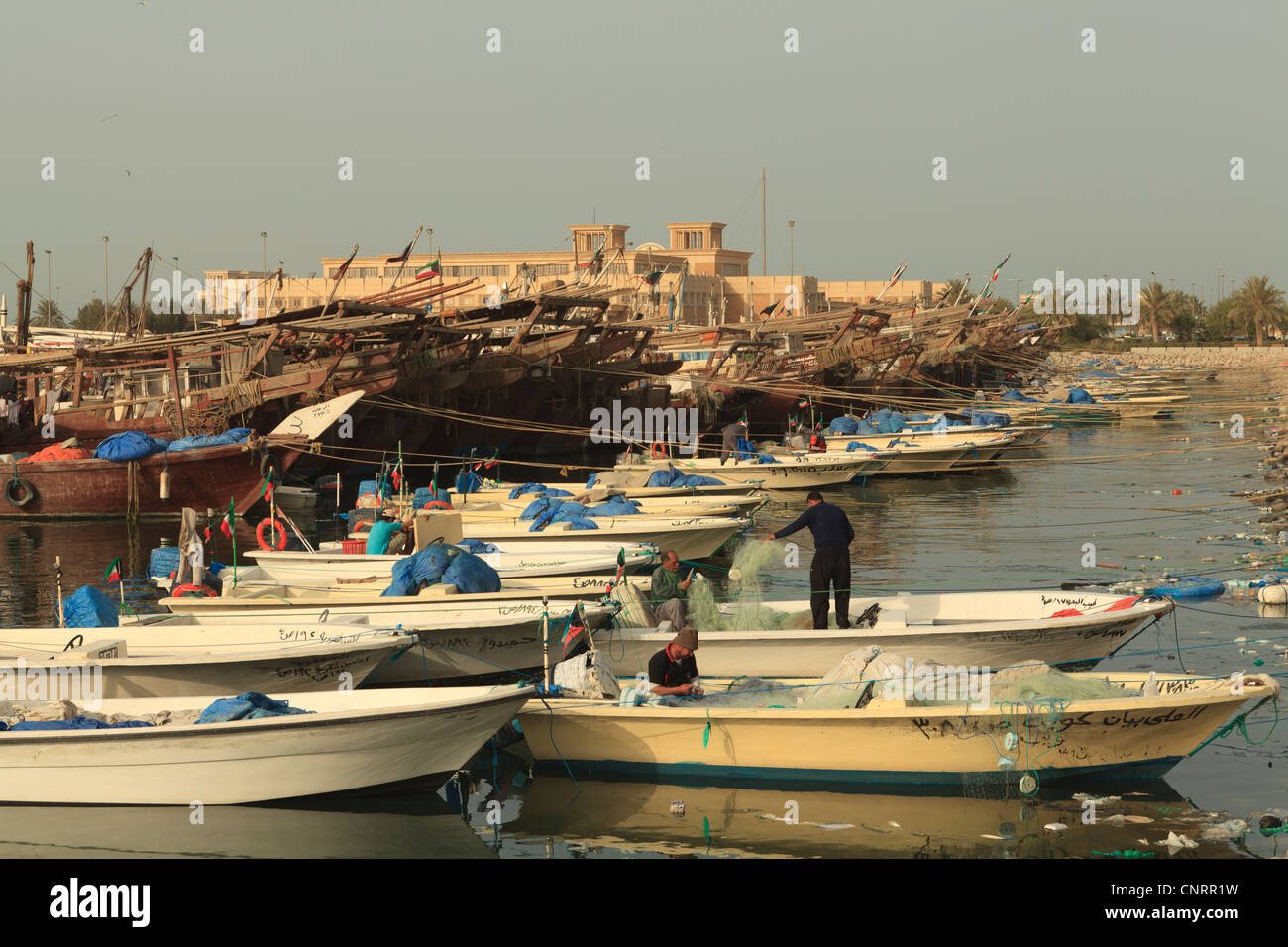 Fishing boats and Dhows in Kuwait City moored up next to the Fish Market Stock Photo