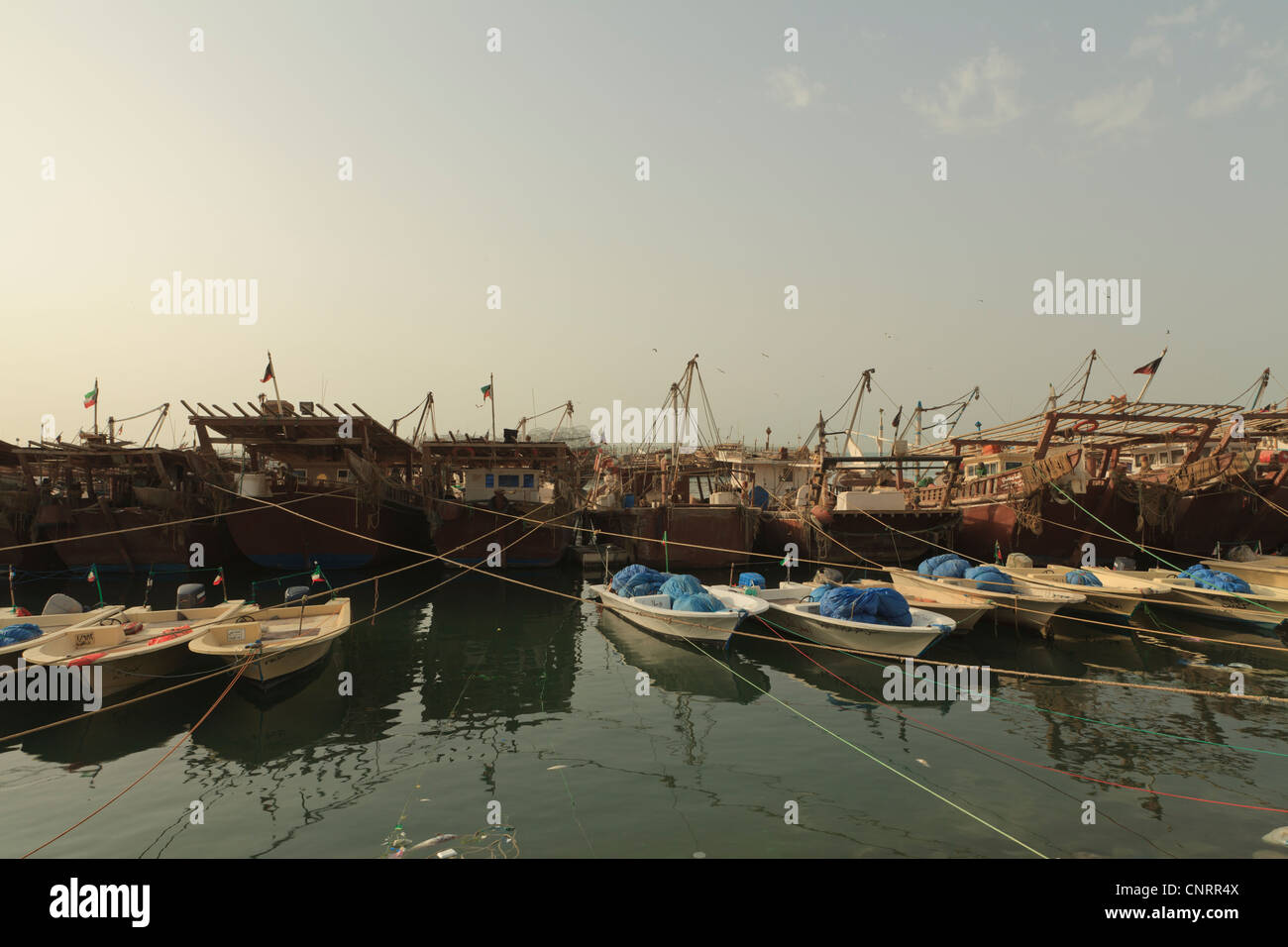 Fishing boats and Dhows in Kuwait City moored up next to the Fish Market Stock Photo Alamy