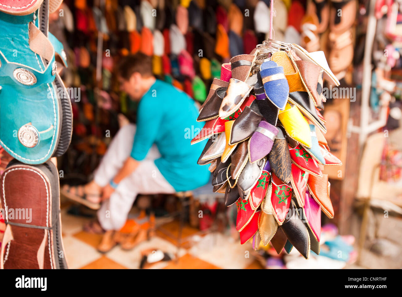 Traditional Moroccan slippers on a stand at a souk in Marrakech, Morocco, North Africa. Stock Photo