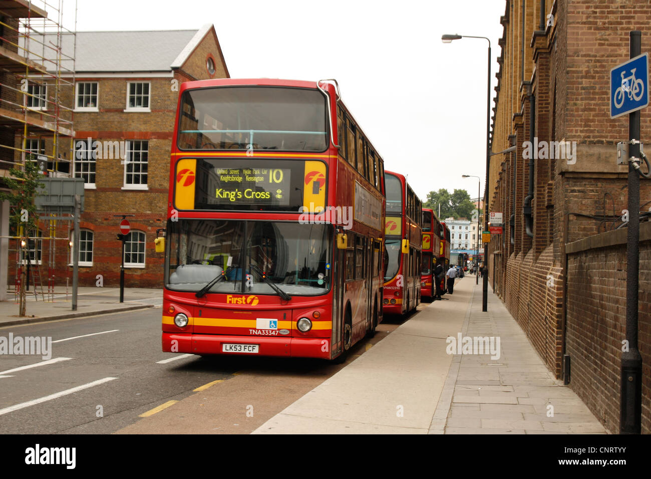 Red London Buses at, London's Kings Cross. No 10, Oxford Street, Hyde Park Corner, Knightsbridge and Kensington Stock Photo