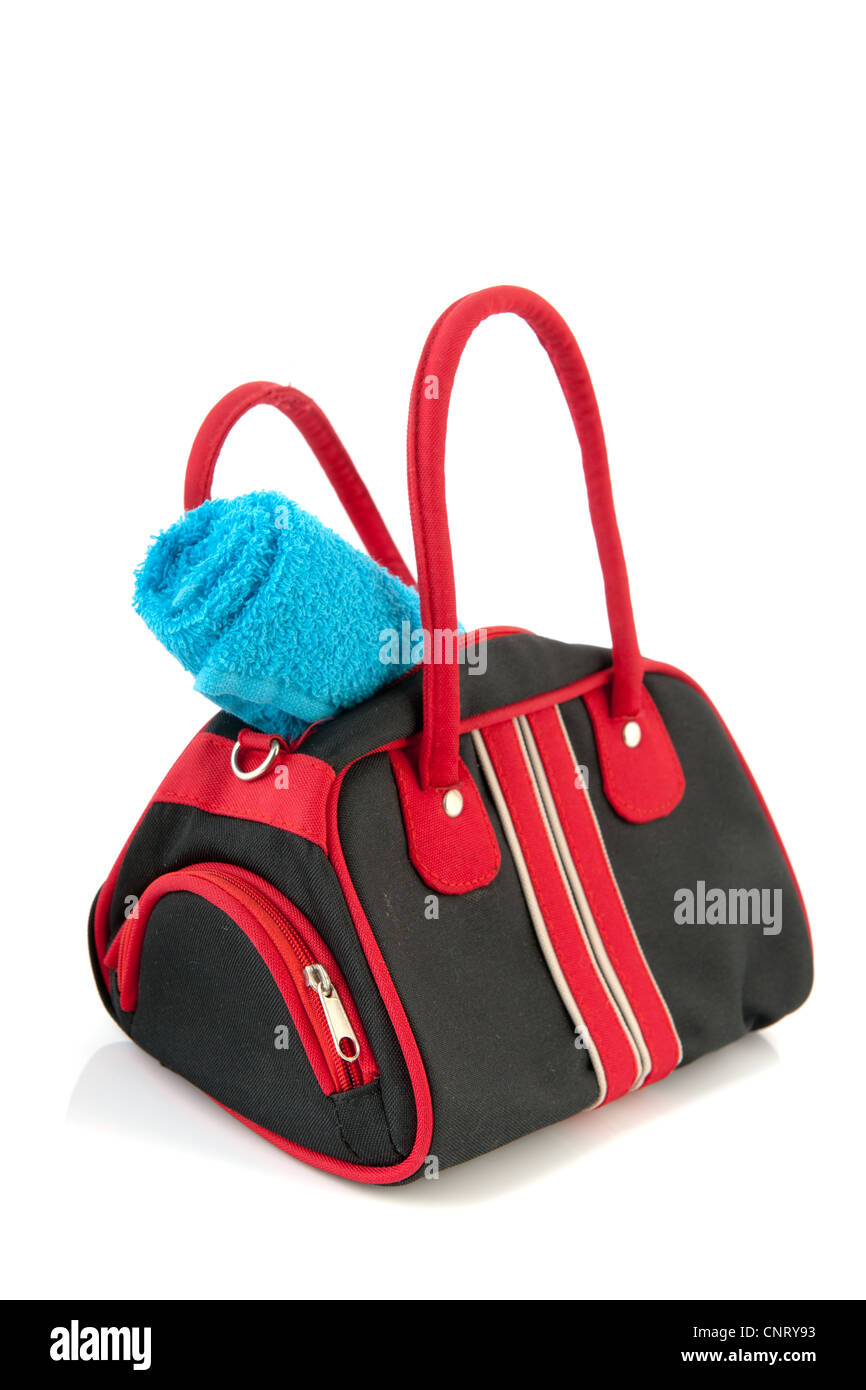 Black sport bag with blue towel isolated over white background Stock Photo