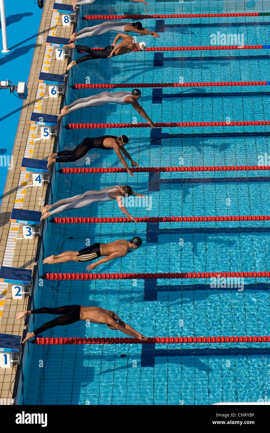 Start of men's swimming race Stock Photo - Alamy