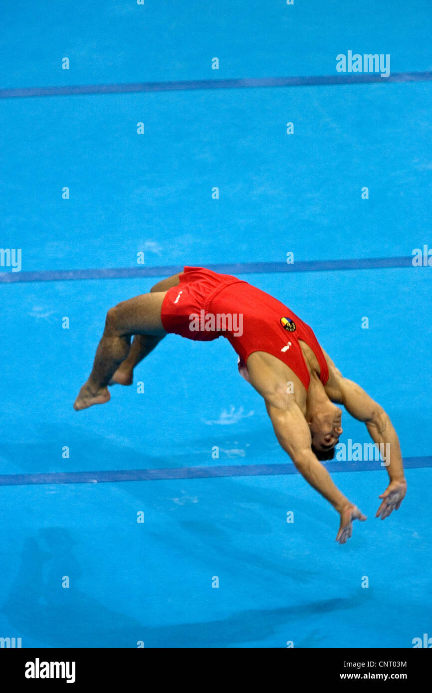 GYMNASTICS Marian Dragulescu (ROM) competing in the floor exercise during the men's team final 2004 Olympic Summer Games, Athens Stock Photo