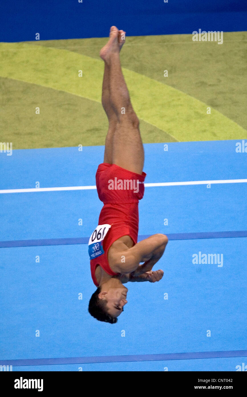 GYMNASTICS Marian Dragulescu (ROM) competing in the floor exercise during the men's team final 2004 Olympic Summer Games, Athens Stock Photo