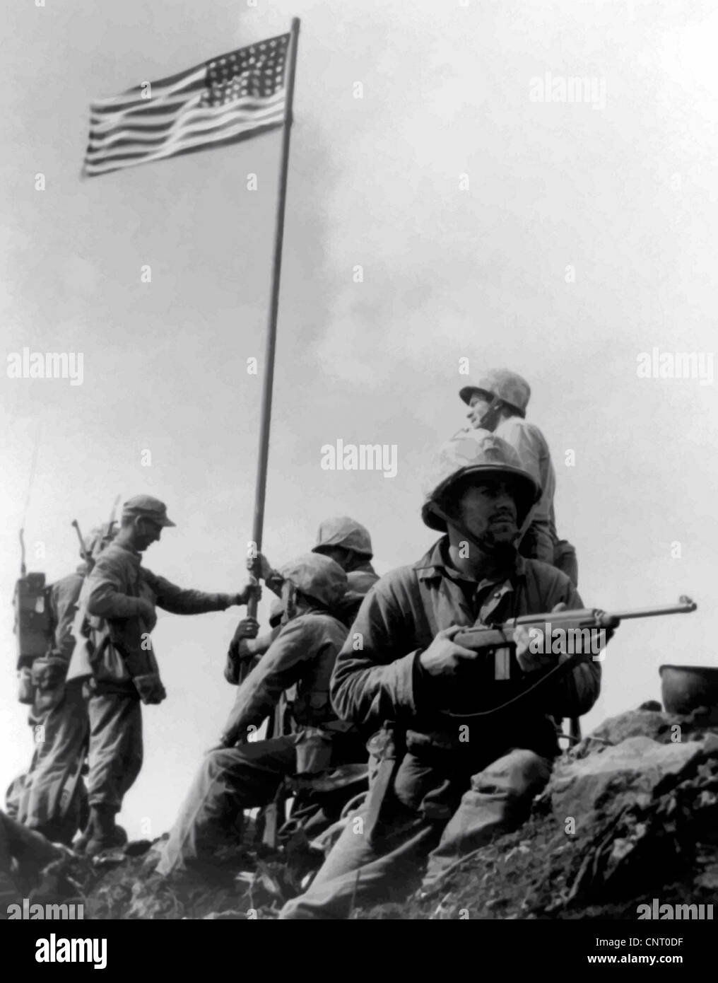 Digitally restored vector photograph of the 1st American flag raising during the Battle Of Iwo Jima on Mount Suribachi. Stock Photo
